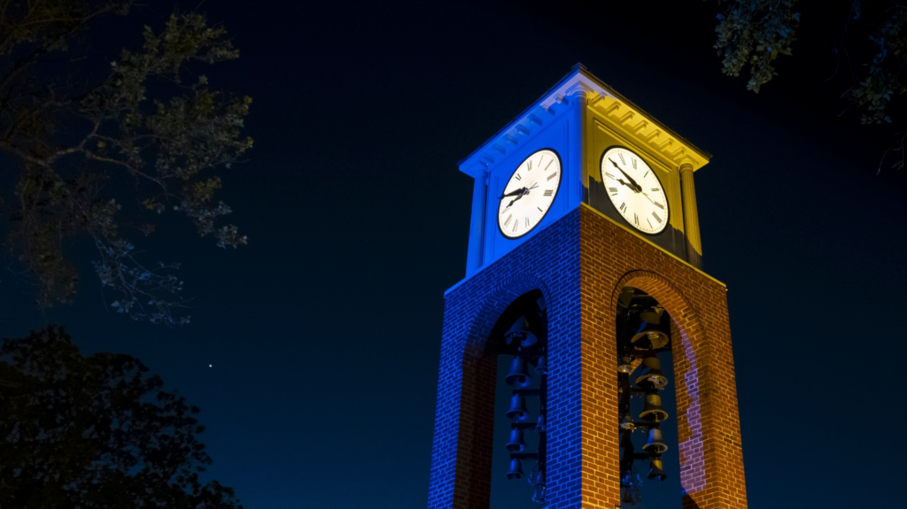UNCG clock tower at night